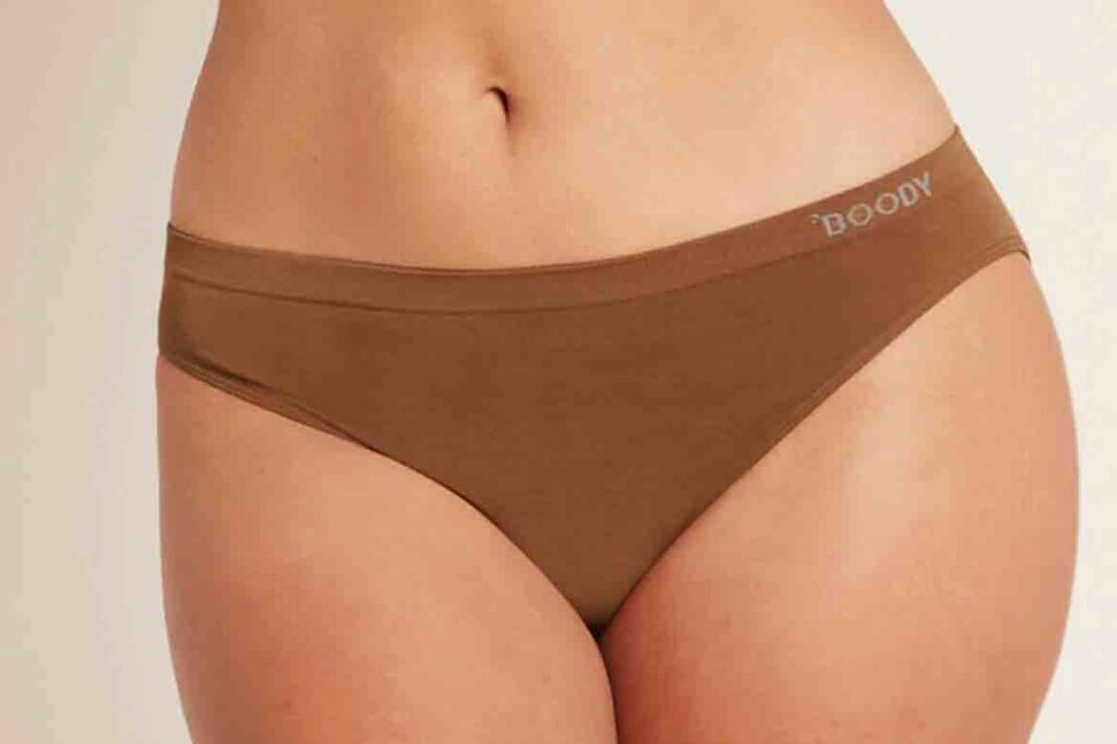 Model wearing boody underwear in brown.